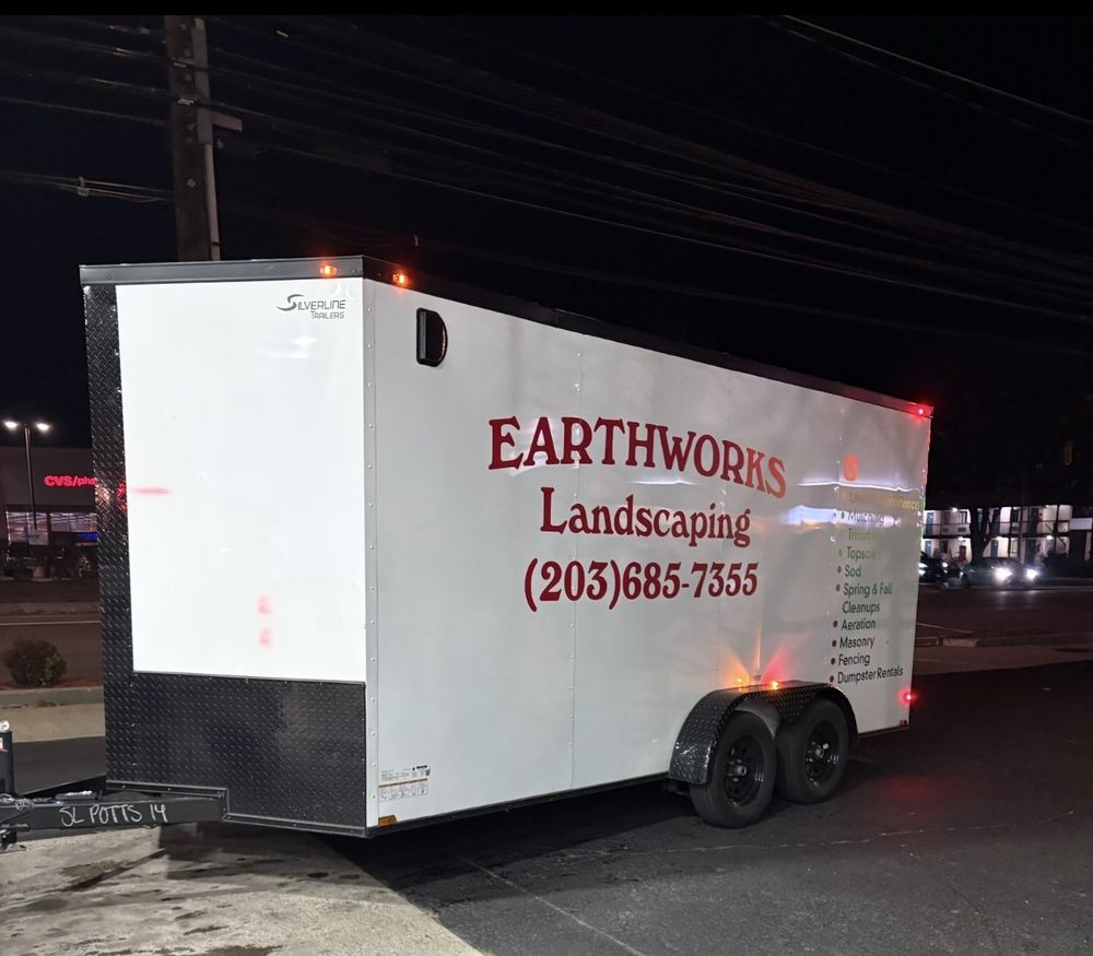 Earthworks Landscaping enclosed work trailer loaded up after a job